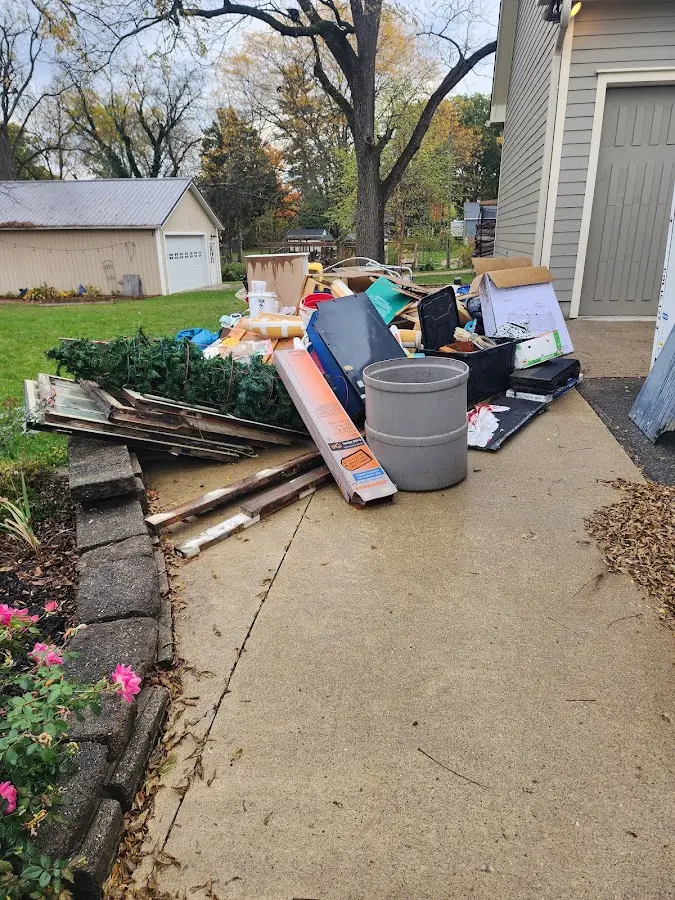Dumpster being loaded with debris for 3 Yard Dumpster Rental in Sweetwater